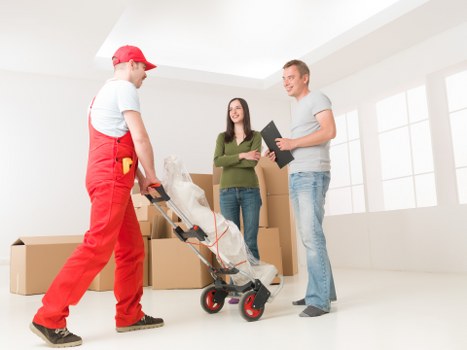 Packed office furniture and file boxes ready for relocation service